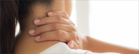 child rubbing neck